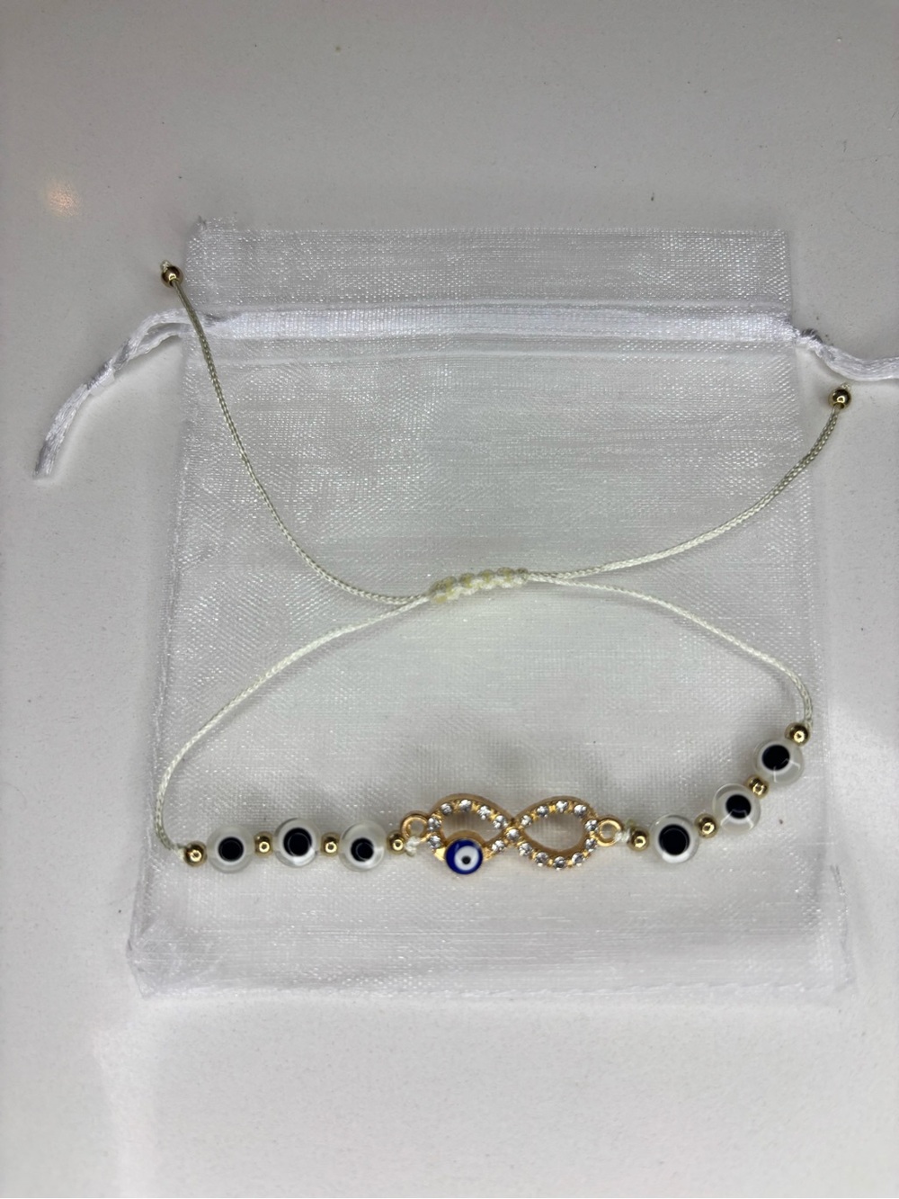 Evil Eye Infinity Bracelet - White Cord with Gold Accents